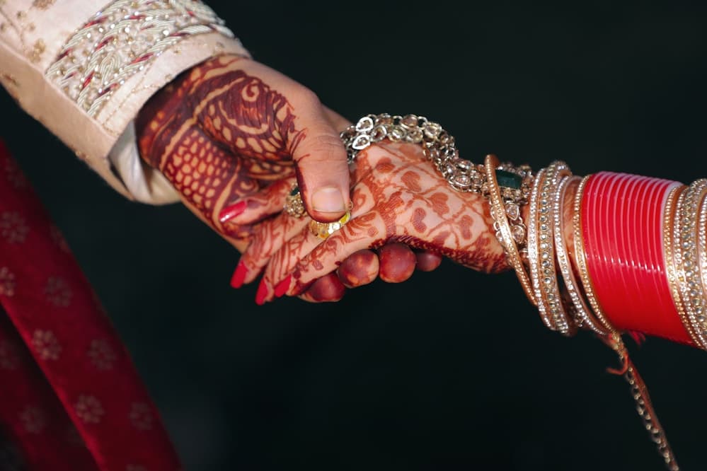 Couple holding hands during an intimate ceremony